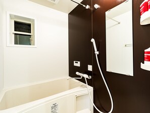 Separate tub and shower, free toiletries, hair dryer, slippers