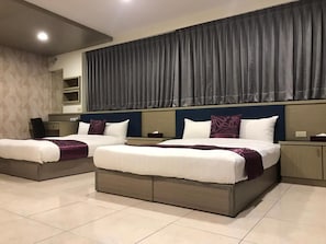 A hotel room with two beds, a large window with curtains, a bedside table, and a built-in shelf. - Rural Area Hotel (Zhuqi)