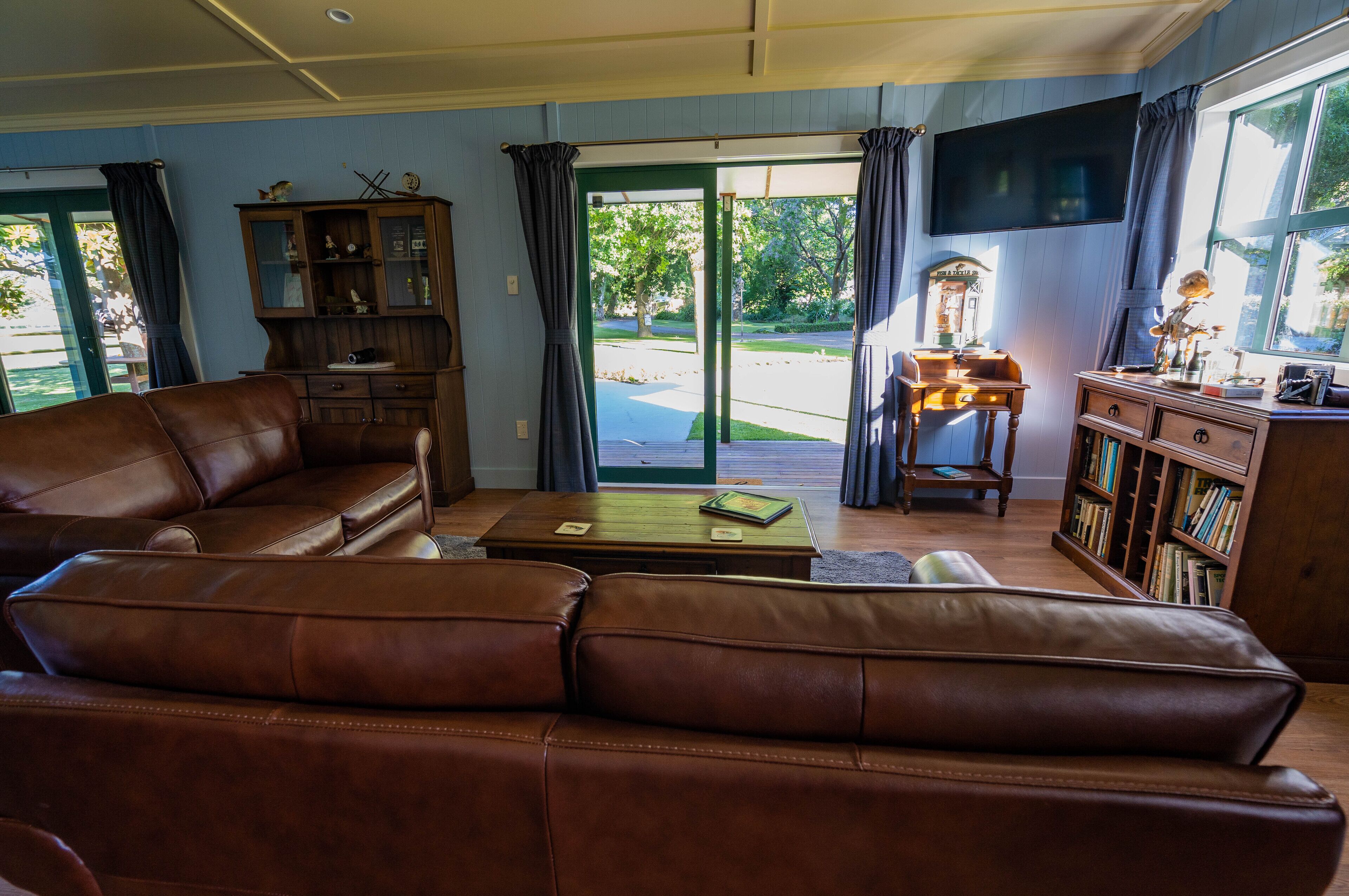 Fishing Cottage | Living area | 40-inch Smart TV with satellite channels, TV, fireplace