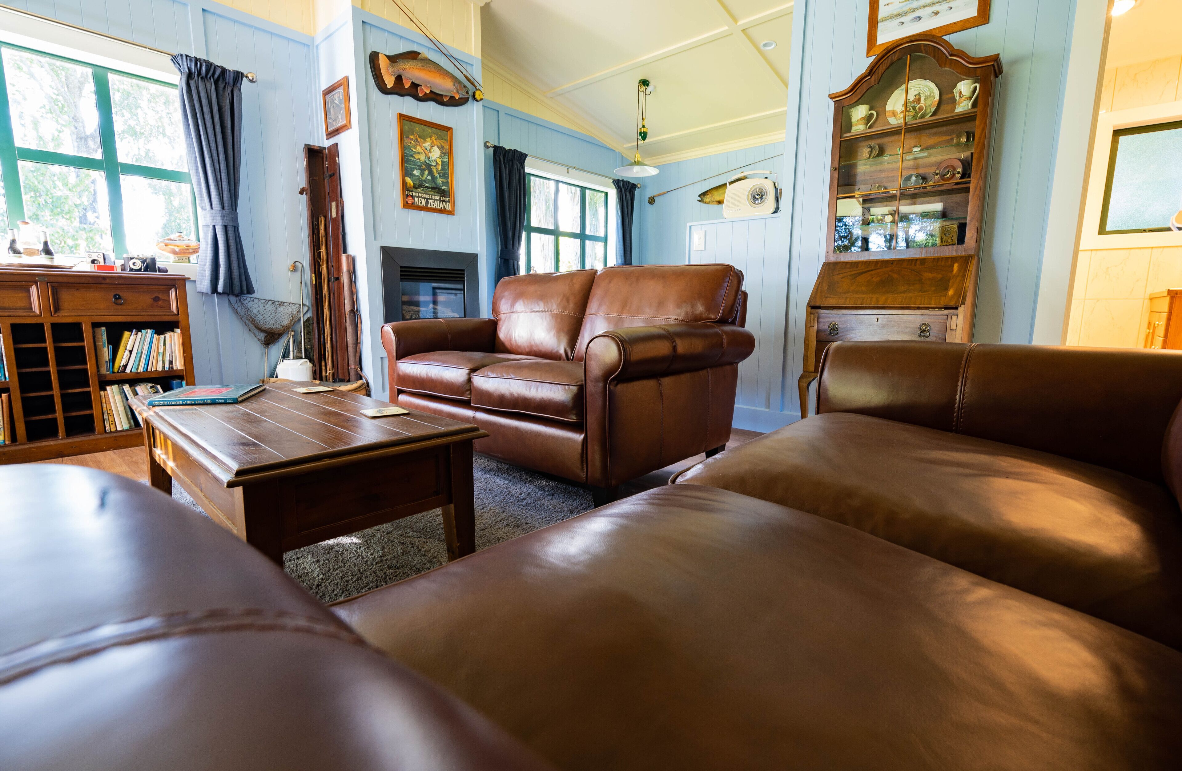 Fishing Cottage | Living room | 40-inch Smart TV with satellite channels, TV, fireplace