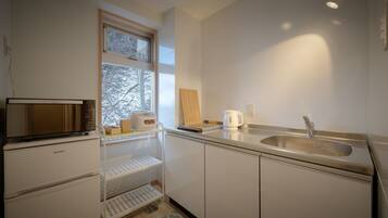 Family Room | Private kitchenette | Shared fridge, microwave