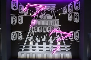 A neon-lit wall with Japanese characters and a stylized illustration of a traditional scene.