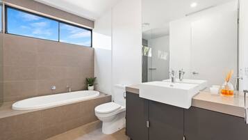 Bathtub, hair dryer, towels