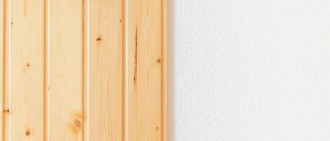 A wooden panel wall with a geometric wooden structure.