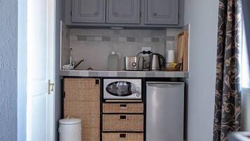 Mini-fridge, microwave, electric kettle, cookware/dishes/utensils