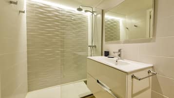 Shower, hair dryer, towels, toilet paper