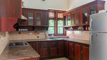 Villa | Private kitchen | Fridge, microwave, stovetop, cookware/dishes/utensils