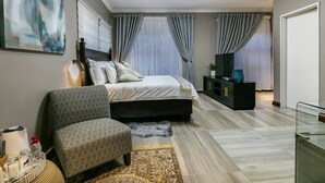 In-room safe, desk, laptop workspace, iron/ironing board (on request) - Orchid Luxury Boutique Guest House (Gaborone)