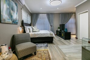 In-room safe, desk, laptop workspace, iron/ironing board - Orchid Luxury Boutique Guest House (Gaborone)