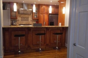 Microwave, dishwasher, coffee/tea maker, cookware/dishes/utensils