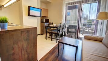 Standard Apartment (B26) | Living area | 32-inch LCD TV with cable channels, TV