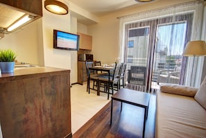 Standard Apartment (B26) | Living area | 32-inch LCD TV with cable channels, TV