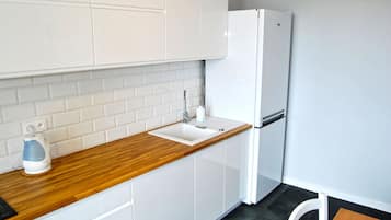Apartment, Sea View | Private kitchen | Fridge, microwave, stovetop, electric kettle