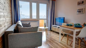 Apartment, 1 Bedroom | Living area | Flat-screen TV