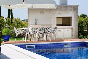 Seasonal outdoor pool, pool umbrellas, pool loungers