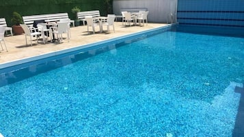 Seasonal outdoor pool, pool umbrellas, pool loungers