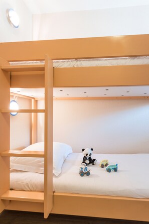 Cozy bunk bed room with two beds, perfect for sharing with friends or family.