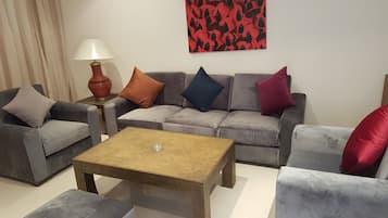 Deluxe Villa | Living area | 42-inch LCD TV with satellite channels, TV