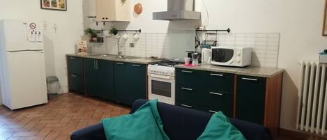 Standard Apartment, 4 Bedrooms | Living area | Flat-screen TV