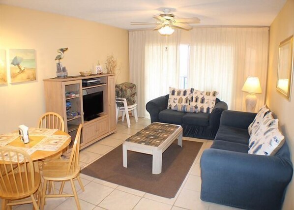 Condo, Multiple Beds, Balcony, Garden View | Living room | TV