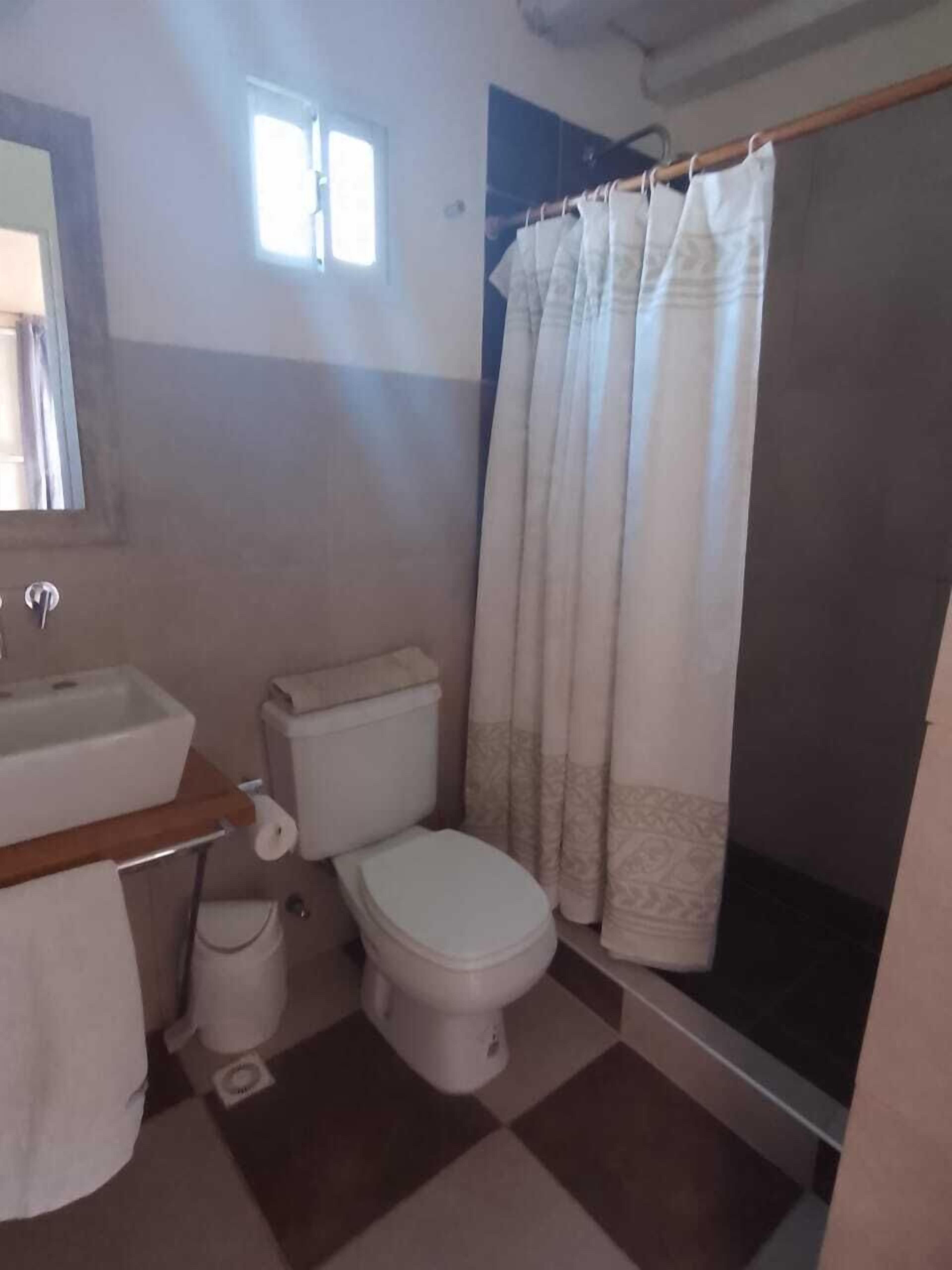 Shower, rainfall showerhead, hair dryer, towels