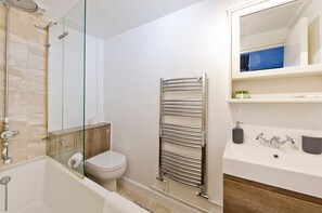 Bathtub, hair dryer, towels, soap