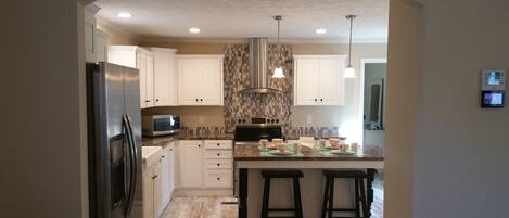 Microwave, coffee/tea maker, cookware/dishes/utensils