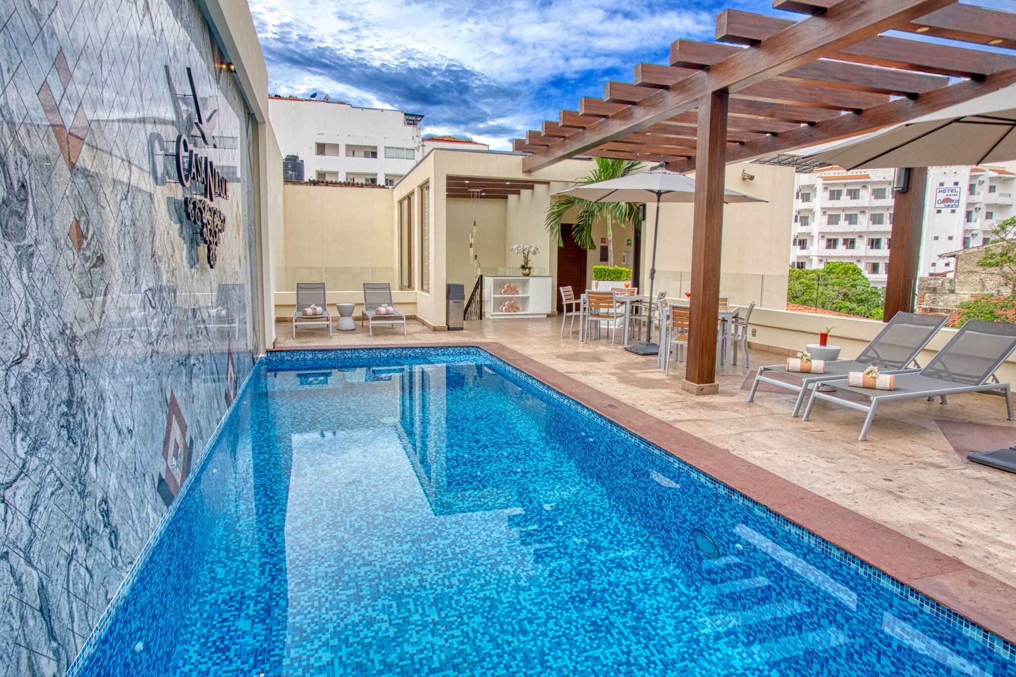 Outdoor pool, open 10:00 AM to 8:00 PM, pool umbrellas, sun loungers