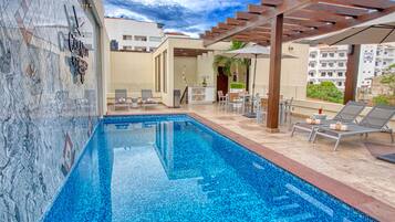 Outdoor pool, open 10:00 AM to 8:00 PM, pool umbrellas, pool loungers