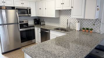 Condo, Multiple Beds, Balcony, Ocean View | Private kitchen | Fridge, microwave, stovetop, dishwasher