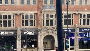 A street view with Digbeth Works Lounge Bar, O2 Institute, and a grey van. - Birmingham city centre apartment  (Birmingham)