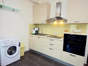 Fridge, oven, cookware/dishes/utensils