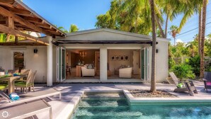 A modern house with a pool, outdoor seating, and a covered patio. - **MIDTOWN MOSAIC @ MIDTOWN** Home & Pool + Last Key White Glove Service... (Key West)