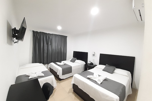 Superior Triple Room | Blackout drapes, iron/ironing board, free WiFi, bed sheets