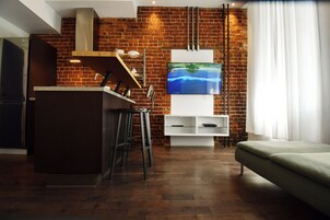 Studio Loft - Suite 204 | Living area | 42-inch flat-screen TV with digital channels, TV