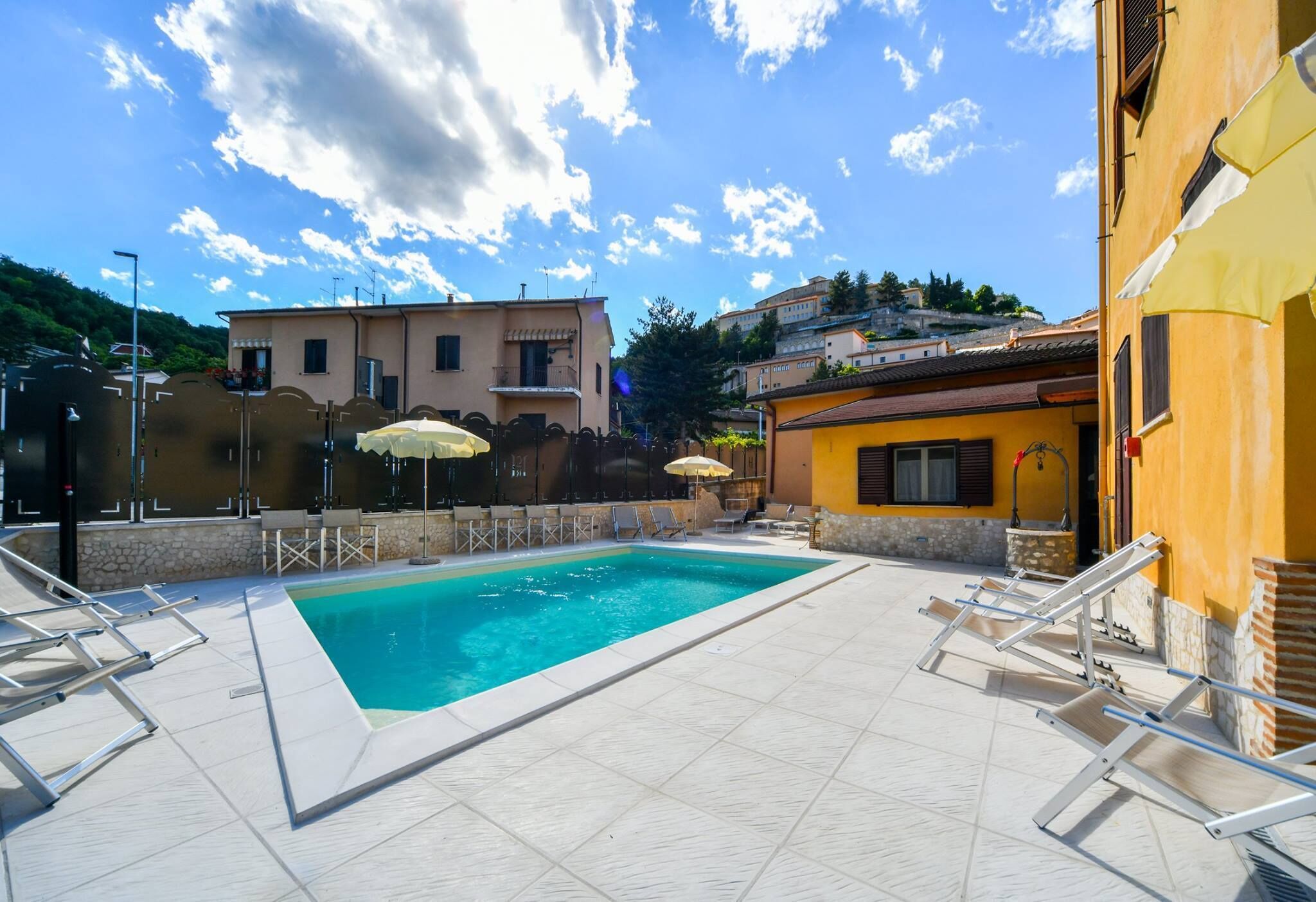 Seasonal outdoor pool, open 10:00 AM to 7:30 PM, pool umbrellas