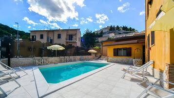 Seasonal outdoor pool, open 10:00 AM to 7:30 PM, pool umbrellas