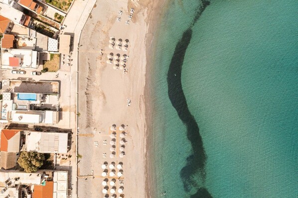On the beach, sun loungers, beach towels
