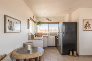 Enjoy meals in the kitchen with an oven and dining area.