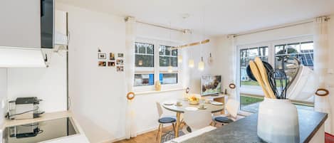Fridge, stovetop, dishwasher, coffee/tea maker