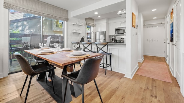 A modern kitchen with white cabinets, a stainless steel refrigerator, and a microwave. - RMR: Cinquefoil 1615 Condo in The Aspens/Wilson,WY (Wilson)