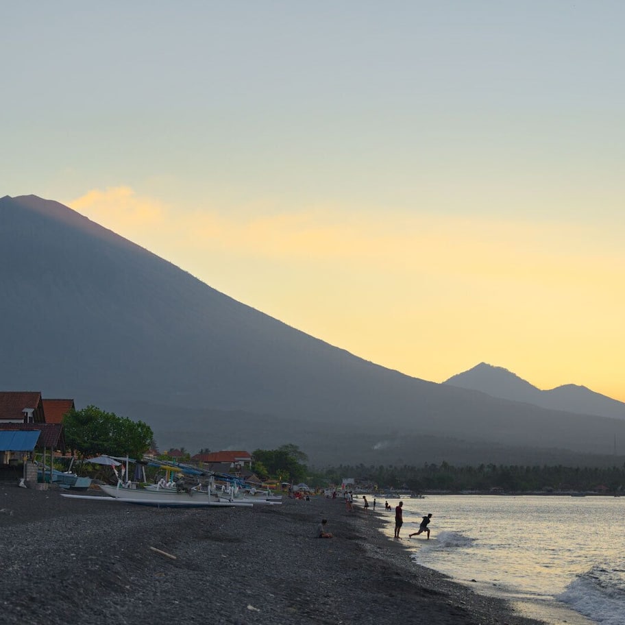 On the beach, black sand