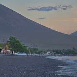 On the beach, black sand