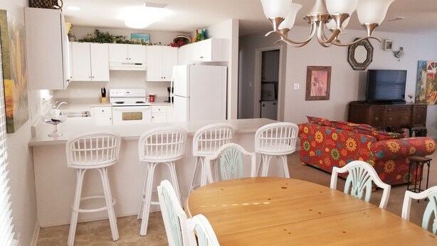 A compact living space with a kitchen, dining area, and a living room. - Lazy Daze! Pups OK, Ideal location! Fenced Yard, Nice House. Wonderful! (Gulf Shores)