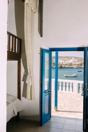 Traditional Quadruple Room, Sea View, Beachfront | Individually decorated, individually furnished, laptop workspace - Akrotiri (Astypalaia)