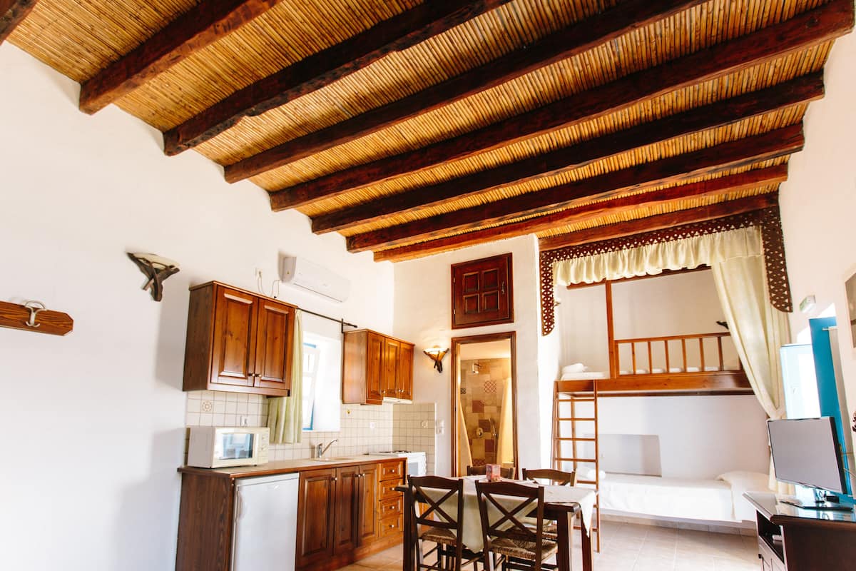 Traditional Quadruple Room, Sea View, Beachfront | Private kitchen | Fridge, microwave, stovetop, coffee/tea maker