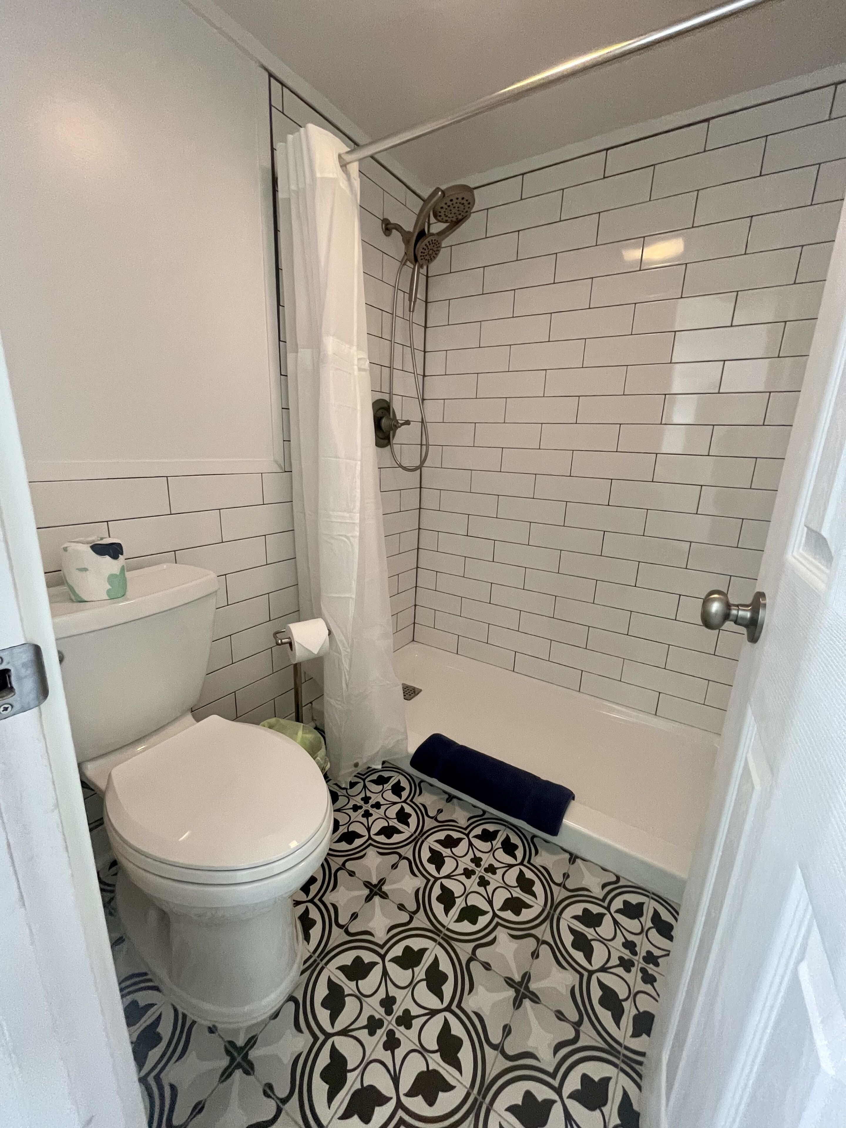 Combined shower/tub, hair dryer, towels, soap