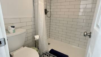 Combined shower/tub, hair dryer, towels, soap
