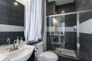 Shower, hair dryer, towels, shampoo