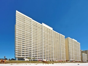 A multi-story hotel with a uniform exterior and a flat roof.